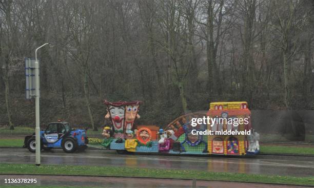 decorated truck in the rain - carnaval limburg stock pictures, royalty-free photos & images