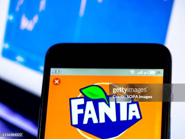 In this photo illustration a Fanta logo seen displayed on a smart phone.