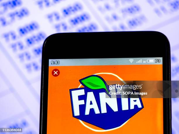 In this photo illustration a Fanta logo seen displayed on a smart phone.