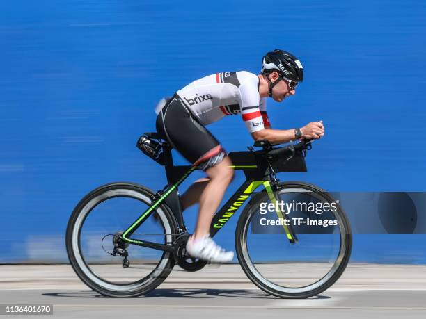 Athlete ride a bike during the AJ Bell Triathlon at the ExCel Exhibition Centre on August 05, 2018 in London, England.