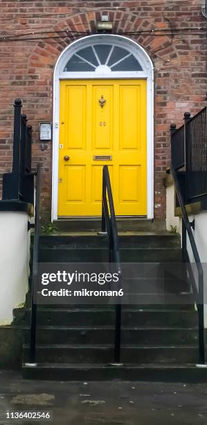 english yellow front, door - door number 6 stock pictures, royalty-free photos & images