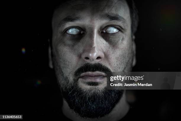 blind man with white eyes - demon stockfoto's en -beelden