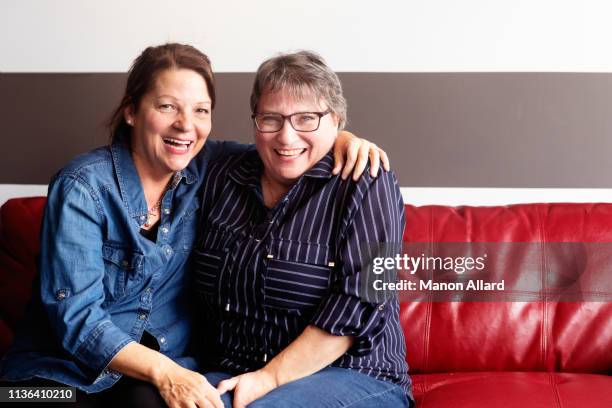 two sisters making a hug - older sister stock pictures, royalty-free photos & images