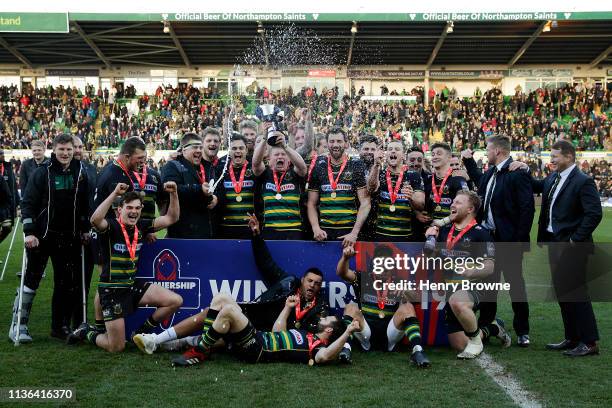 Northampton Saints celebrate with the trophy after winning the Premiership Rugby Cup Final match between Northampton Saints and Saracens at...