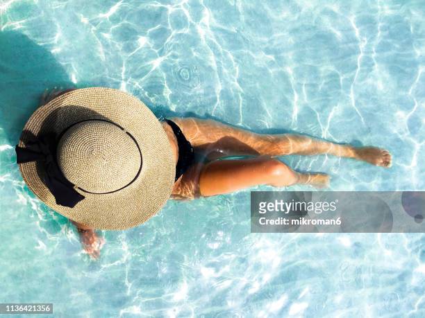 young woman enjoying time on the beach in tropical country - hot spanish women stock pictures, royalty-free photos & images