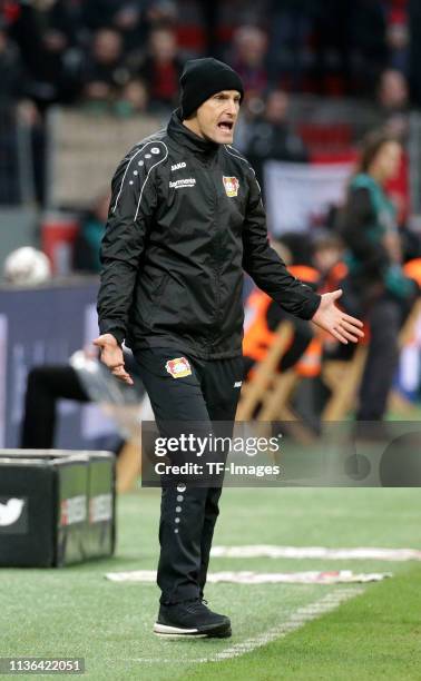 Head coach Heiko Herrlich of Bayer Leverkusen gestures during the Bundesliga match between Bayer 04 Leverkusen and FC Augsburg at the BayArena on...