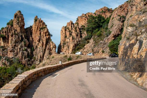 road along the famous calanques de piana in corsica, france - calanques stock pictures, royalty-free photos & images