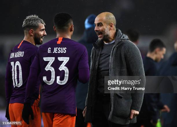 Josep Guardiola, Manager of Manchester City celebrates victory with Sergio Aguero and Gabriel Jesus of Manchester City during the FA Cup Quarter...