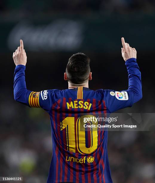 Lionel Messi of FC Barcelona celebrates scoring his team's opening goal during the La Liga match between Real Betis Balompie and FC Barcelona at...