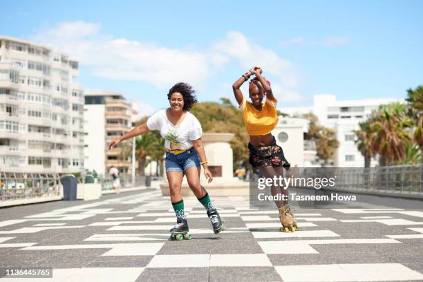 women on wheels - cape town stock pictures, royalty-free photos & images