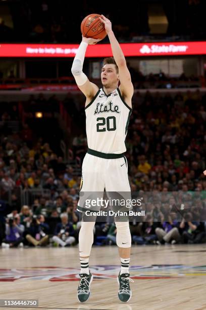 Matt McQuaid of the Michigan State Spartans attempts a shot in the first half against the Michigan Wolverines during the championship game of the Big...