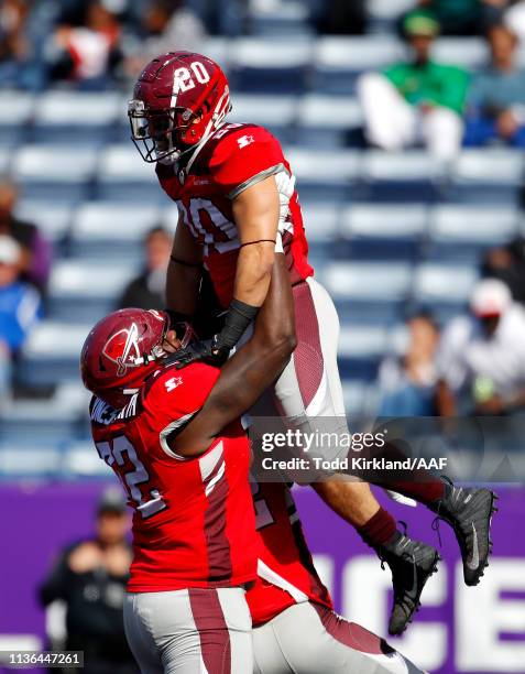 Kenneth Farrow, II of the San Antonio Commanders is congratulated by his teammate Jaryd Jones-Smith after scoring a rushing touchdown against the...