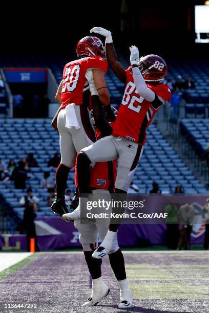 Kenneth Farrow, II of the San Antonio Commanders is congratulated by his teammates Mekale McKay and Jaryd Jones-Smith after scoring a rushing...