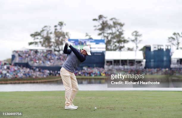 Rory McIlroy of Northern Ireland plays his shot from the 17th tee during the final round of The PLAYERS Championship on The Stadium Course at TPC...