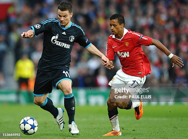 Manchester United's Portuguese midfielder Nani vies with Schalke's German midfielder Alexander Baumjohann during the UEFA Champions League semi-final...