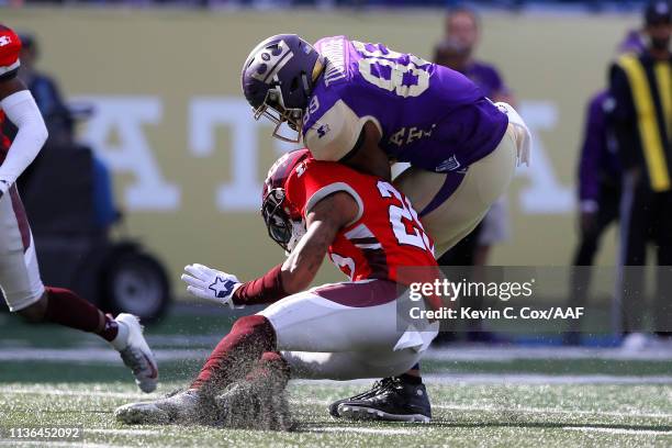 Keith Towbridge of the Atlanta Legends is tackled by Kurtis Drummond of the San Antonio Commanders during the first half in the Alliance of American...