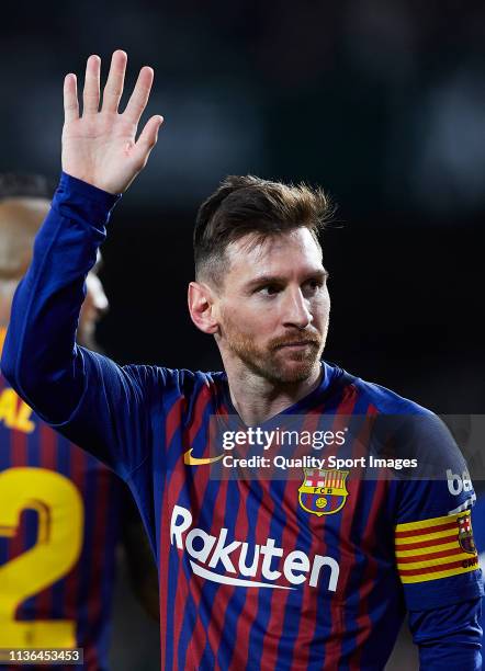 Lionel Messi of FC Barcelona celebrates scoring his team's third goal during the La Liga match between Real Betis Balompie and FC Barcelona at...