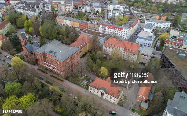 April 2019, Brandenburg, Eberswalde: The building complex of the Hochschule für nachhaltige Entwicklung Eberswalde , aerial view with a drone. Photo:...