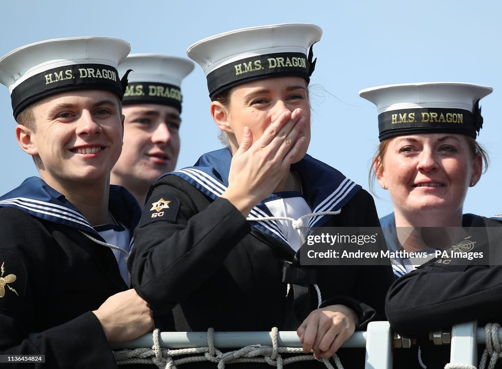 A Crew Member Blows A Kiss Onboard HMS Dragon As She Returns To News a-crew-member-blows-a-kiss-onboard-hms-dragon-as-she-returns-to-news
