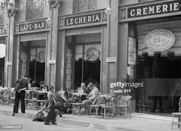 People have a drink on the terrace of a cafe, in April 1949 in Barcelona.