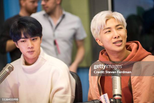 Jin and RM of BTS visit The Elvis Duran Z100 Morning Show at Z100 Studio on April 12, 2019 in New York City.