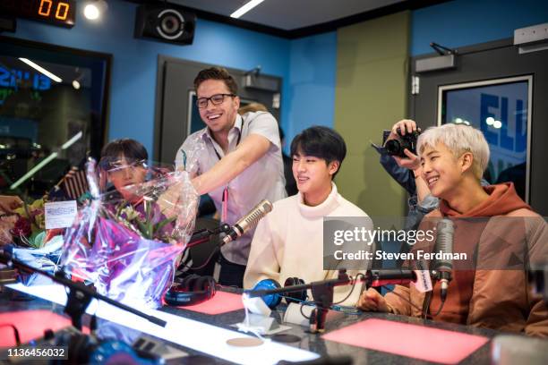 Suga, Jin and RM of BTS visit The Elvis Duran Z100 Morning Show at Z100 Studio on April 12, 2019 in New York City.
