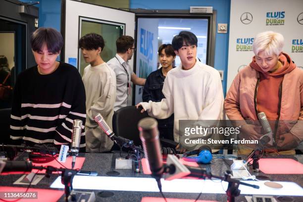Suga, Jungkook, J-Hope, Jin and RM of BTS visit The Elvis Duran Z100 Morning Show at Z100 Studio on April 12, 2019 in New York City.