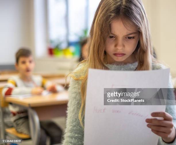 beautiful schoolgirl is sad because bad grade - miss f stock pictures, royalty-free photos & images
