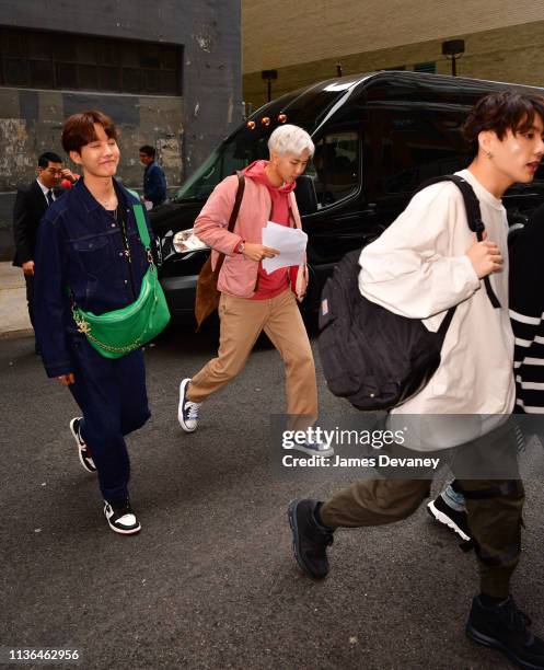 Hope, RM and Jungkook of BTS seen on the streets of Manhattan on April 12, 2019 in New York City.