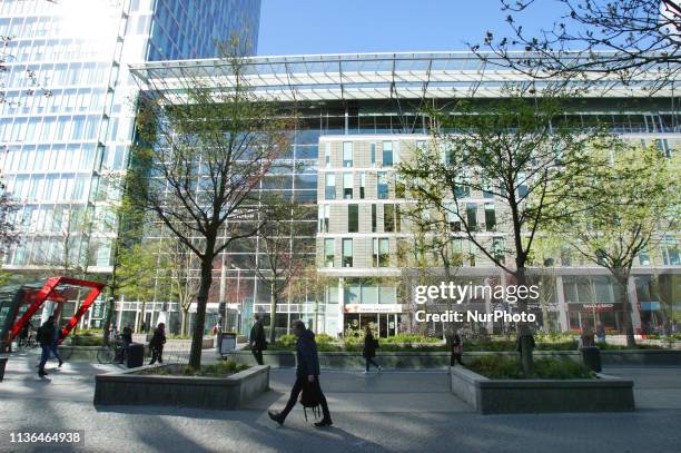 People pass by office buildings in the Zuidas financial district on April 12, 2019 in Amsterdam,Netherlands. The pending exit of the United King from...