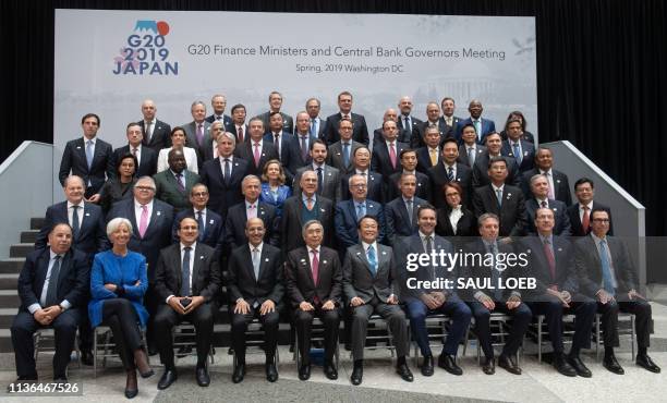 Finance ministers, bank governors and other officials participate in the G20 Finance Ministers and Central Bank Governors Meeting family photo during...