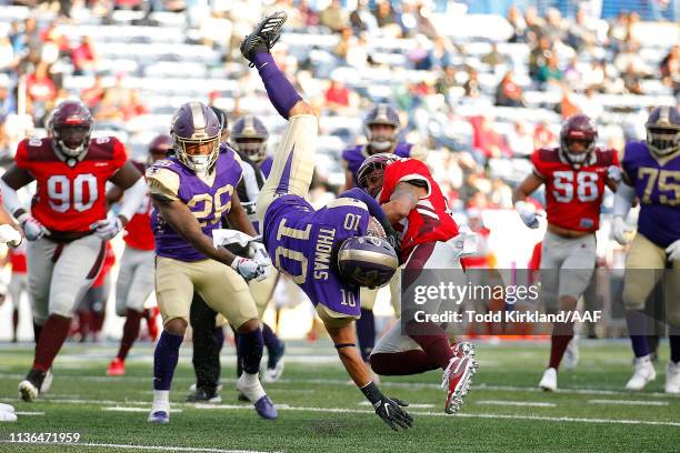 Justin Thomas of the Atlanta Legends is tackled by Jordan Thomas of the San Antonio Commanders during the second half in the Alliance of American...