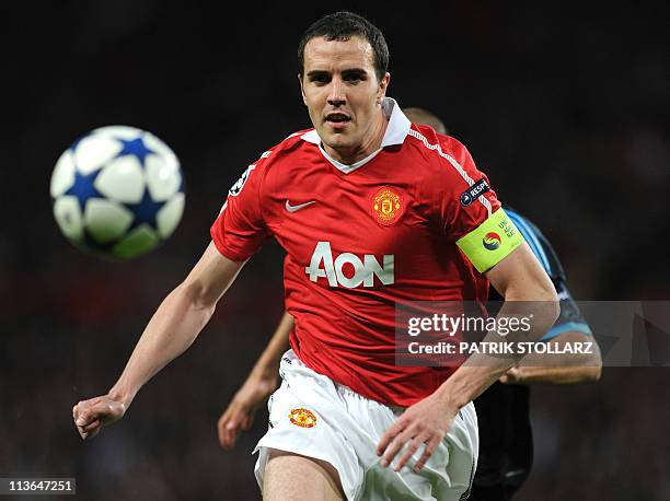 Manchester United's Irish defender John O'Shea eyes the ball during the UEFA Champions League semi-final second leg football match between Manchester...