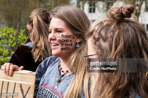 Protester at the YouthStrike4Climate student march on April 12, 2019 in London, United Kingdom. Students are protesting across the UK due to the lack...