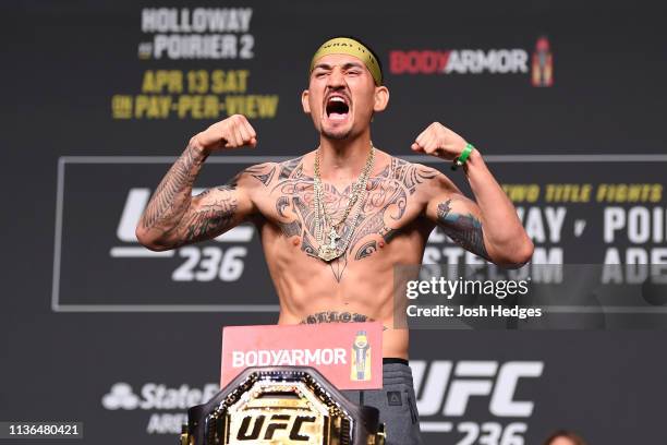 Max Holloway poses on the scale during the UFC 236 weigh-in at State Farm Arena on April 12, 2019 in Atlanta, Georgia.