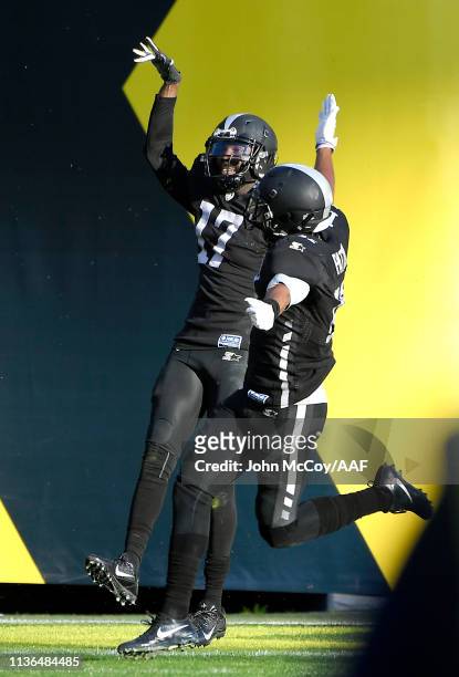 Damian Washington of the Birmingham Iron celebrates with teammates in the end zone after scoring an 83-yard touchdown during the second quarter...