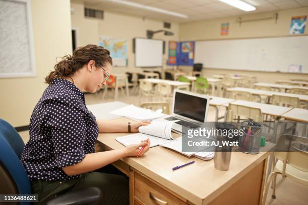 preparing notes for the class - teacher preparation stock pictures, royalty-free photos & images