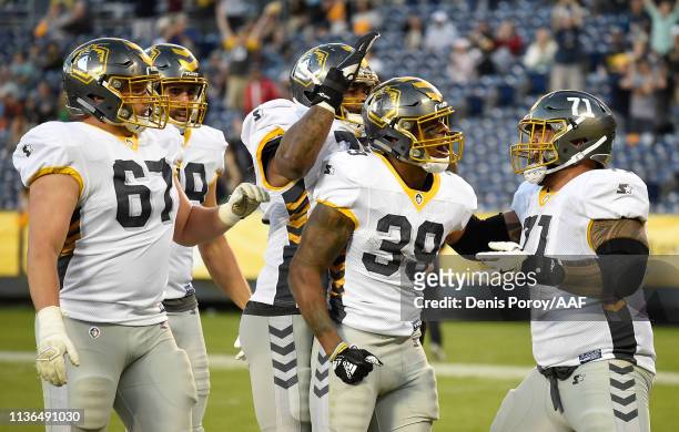 Terrell Watson of the San Diego Fleet celebrates with teammates after scoring a touchdown during the third quarter against the Birmingham Iron in an...