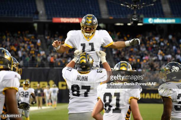 Mike Bercovici of the San Diego Fleet celebrates with teammates after throwing a touchdown pass during the third quarter against the Birmingham Iron...