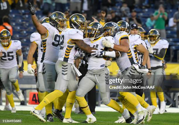 Demetrius Wright of the San Diego Fleet celebrates with teammates after intercepting a pass during the third quarter against the Birmingham Iron in...