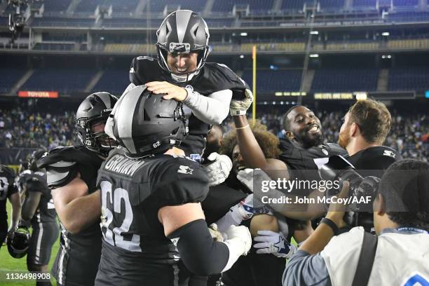 Nick Novak of the Birmingham Iron celebrates with teammates after kicking a 44-yard game-winning field goal during the fourth quarter to defeat the...