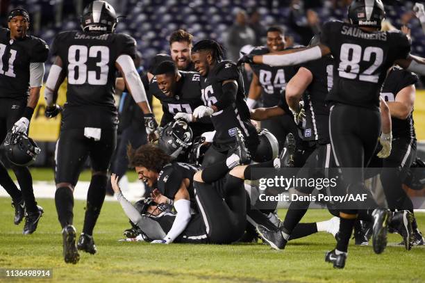 Nick Novak of the Birmingham Iron celebrates with teammates after kicking a 44-yard game-winning field goal during the fourth quarter to defeat the...