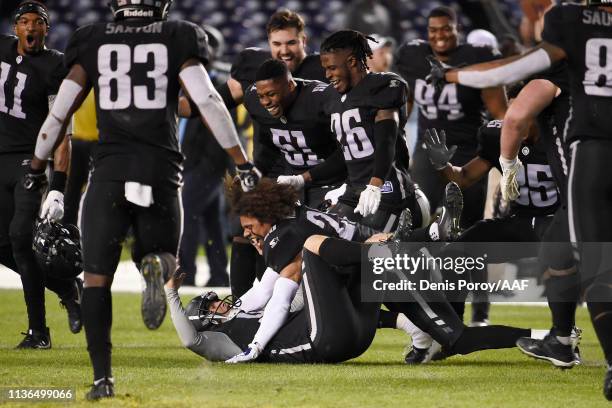 Nick Novak of the Birmingham Iron celebrates with teammates after kicking a 44-yard game-winning field goal during the fourth quarter to defeat the...