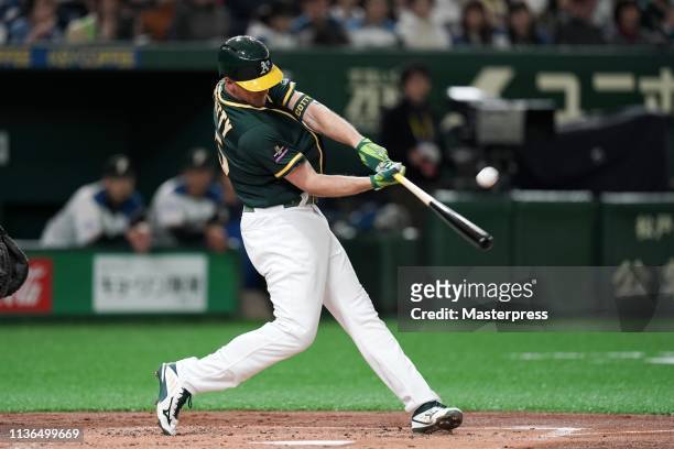 Outfielder Stephen Piscotty of the Oakland Athletics hits a solo homer to make it 1-0 in the top of 2nd inning during the preseason friendly game...