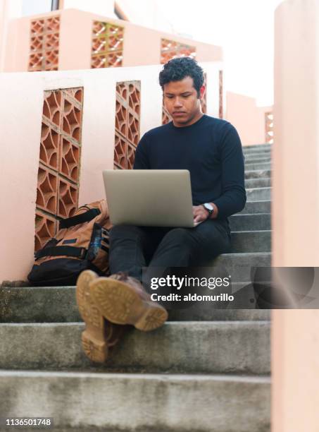 university student sitting on steps - mexico vs honduras stock pictures, royalty-free photos & images