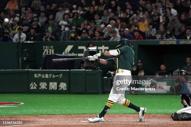 Designated hitter Khris Davis of the Oakland Athletics hits a three run homer to make it 6-6 in the top of 9th inning during the preseason friendly...