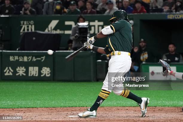 Designated hitter Khris Davis of the Oakland Athletics hits a three run homer to make it 6-6 in the top of 9th inning during the preseason friendly...