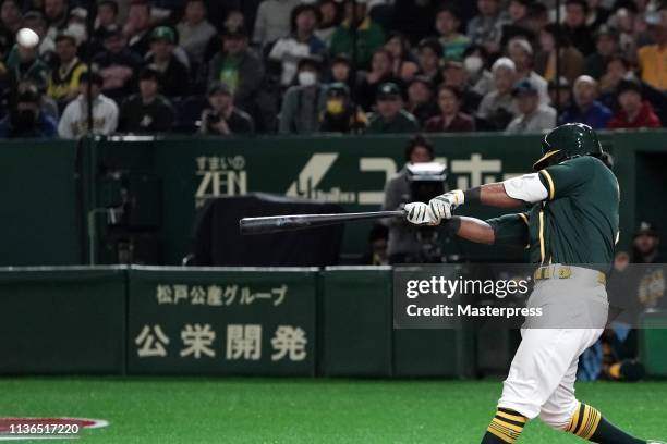 Designated hitter Khris Davis of the Oakland Athletics hits a three run homer to make it 6-6 in the top of 9th inning during the preseason friendly...