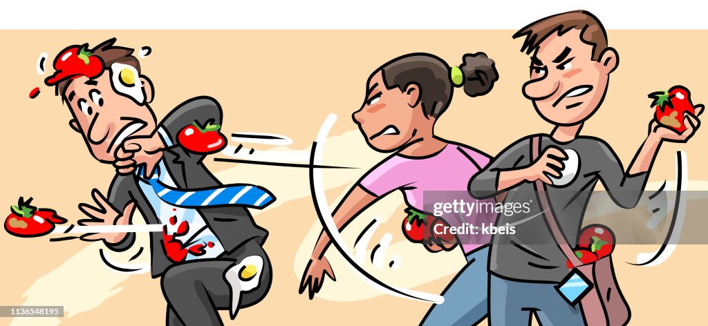 Young People Throwing Tomatoes At Man In Suit