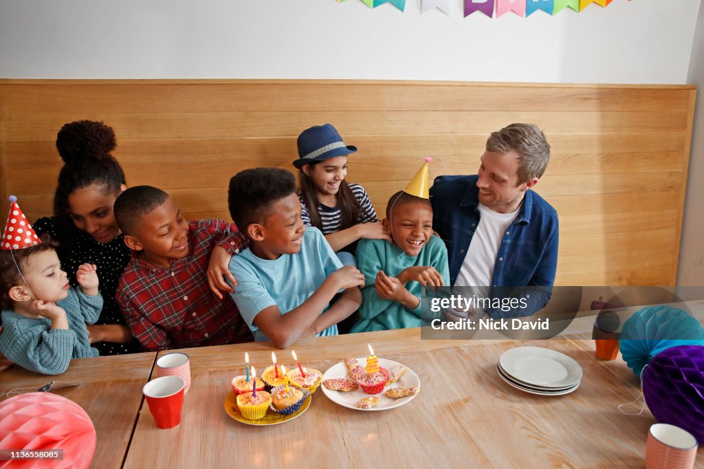 Family with five children celebrating birthday